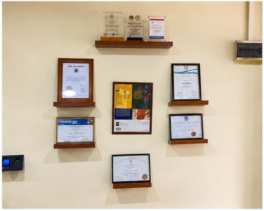 Awards, certificates and professional achievements displayed at The Physiotherapy Clinic
